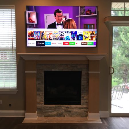 flatscreen above fireplace